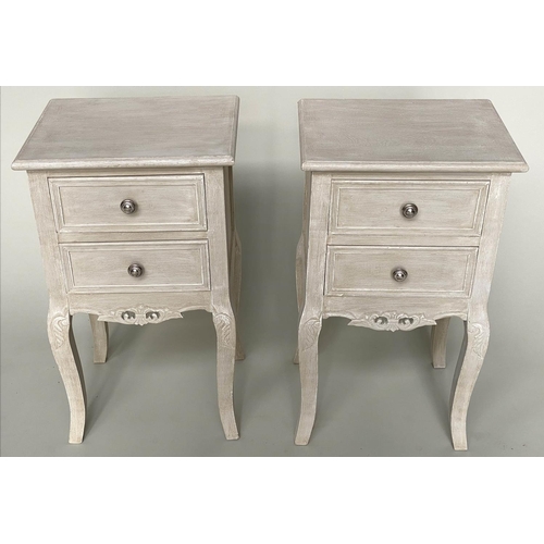 193 - BEDSIDE TABLES, a pair, French style grey painted each with two drawers and carved, pierced apron, 4... 