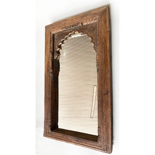 204 - WALL MIRROR, 19th century Indian teak with carved arched frame, 80cm x 120cm H.