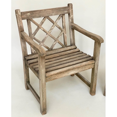 292 - GARDEN ARMCHAIRS BY ALEXANDER ROSE, a pair, weathered teak each slatted with lattice back, 48cm W. (... 