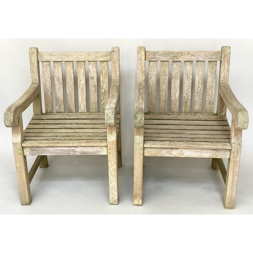 295 - GARDEN ARMCHAIRS, a pair, weathered teak and slatted with flat top arms, 68cm W. (2)