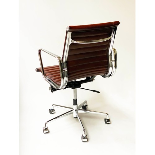 196 - REVOLVING DESK CHAIR, Charles and Ray Eames inspired with ribbed tan leather seat revolving and reta... 