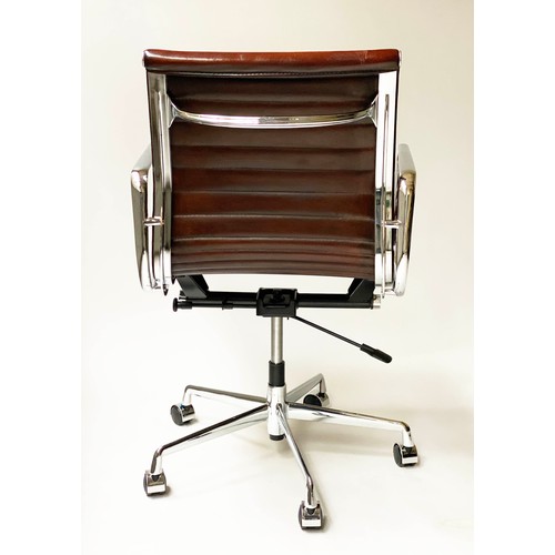 196 - REVOLVING DESK CHAIR, Charles and Ray Eames inspired with ribbed tan leather seat revolving and reta... 