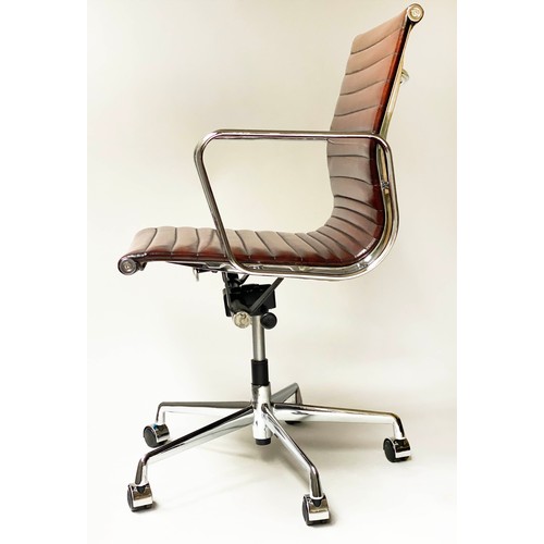 196 - REVOLVING DESK CHAIR, Charles and Ray Eames inspired with ribbed tan leather seat revolving and reta... 