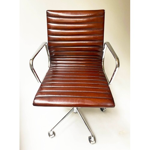 196 - REVOLVING DESK CHAIR, Charles and Ray Eames inspired with ribbed tan leather seat revolving and reta... 