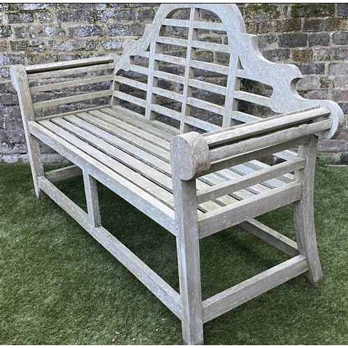 297 - LUTYENS STYLE GARDEN BENCH, weathered teak of slatted construction after a design by Sir Edwin Lutye... 