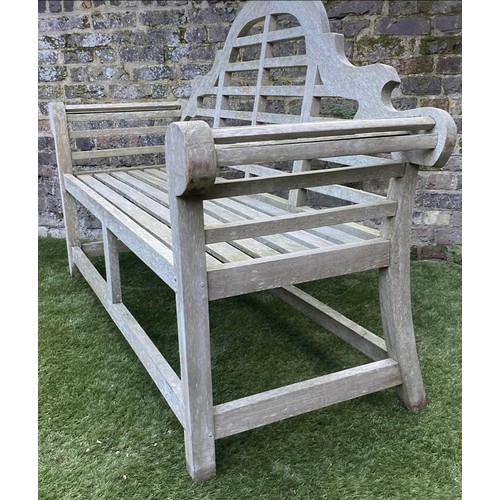 297 - LUTYENS STYLE GARDEN BENCH, weathered teak of slatted construction after a design by Sir Edwin Lutye... 