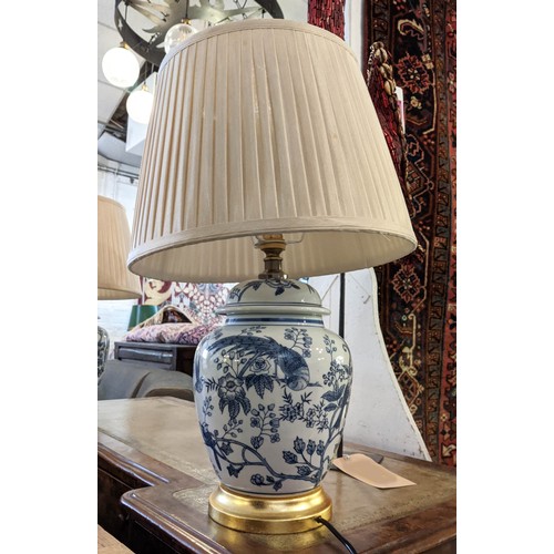 223 - TABLE LAMPS, 55cm H x 35cm W, a pair, Chinese blue and white ceramic with pagoda decoration, with sh... 