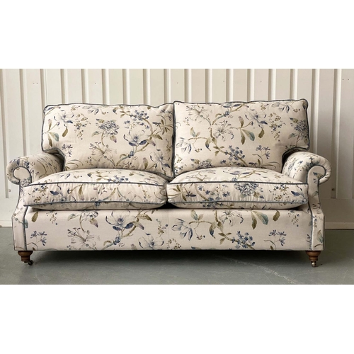 236 - SOFA, Country House style foliate printed upholstery, scroll arms, feather pads and turned front sup... 