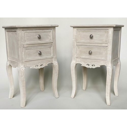 244 - BEDSIDE TABLES, a pair, French style grey painted each with two drawers and carved, pierced apron, 4... 