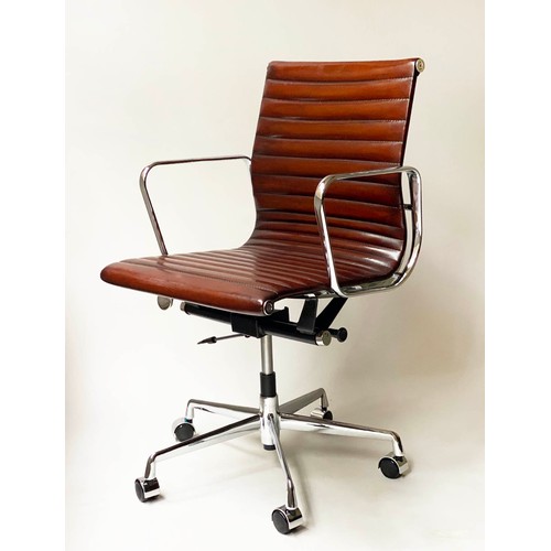 246 - REVOLVING DESK CHAIR, Charles and Ray Eames inspired with ribbed tan leather seat revolving and recl... 