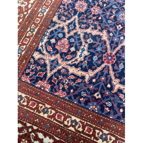 124 - ANTIQUE PERSIAN FEREGHAN CARPET, 370cm x 260cm.