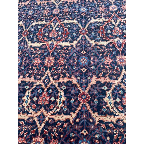 124 - ANTIQUE PERSIAN FEREGHAN CARPET, 370cm x 260cm.