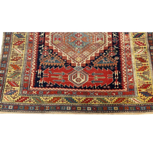 125 - ANTIQUE CAUCASIAN CORRIDOR CARPET, 332cm x 138cm.