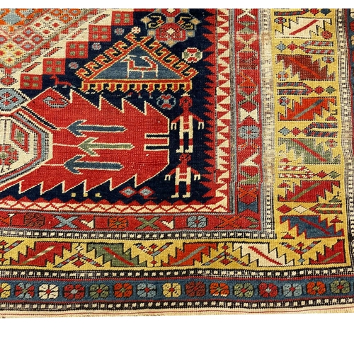 125 - ANTIQUE CAUCASIAN CORRIDOR CARPET, 332cm x 138cm.