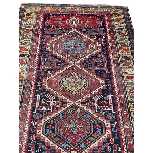125 - ANTIQUE CAUCASIAN CORRIDOR CARPET, 332cm x 138cm.