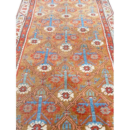126 - ANTIQUE PERSIAN BAKSHAISH RUNNER, 390cm x 99cm.