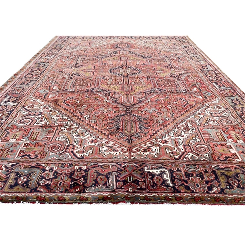129 - PERSIAN HERIZ CARPET, 405cm x 300cm.