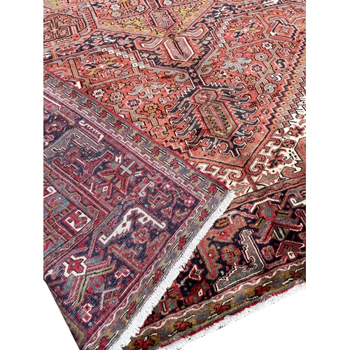 129 - PERSIAN HERIZ CARPET, 405cm x 300cm.