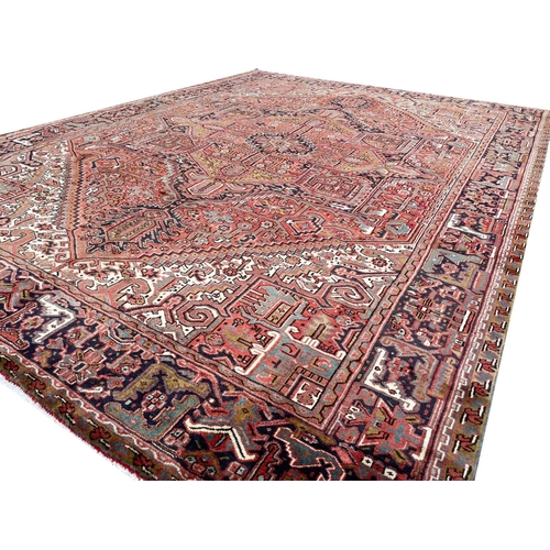 129 - PERSIAN HERIZ CARPET, 405cm x 300cm.