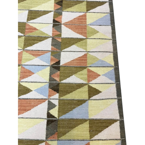 130 - CONTEMPORARY SWEDISH DESIGN KILIM, 302cm x 184cm.