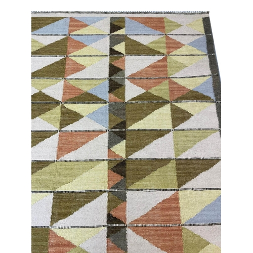 130 - CONTEMPORARY SWEDISH DESIGN KILIM, 302cm x 184cm.