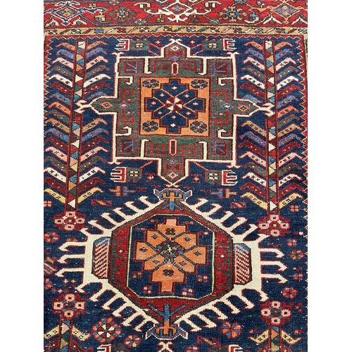 136 - ANTIQUE PERSIAN HERIZ RUG, 190cm x 142cm.