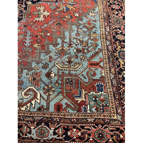 140 - ANTIQUE PERSIAN HERIZ CARPET, 400cm x 293cm.