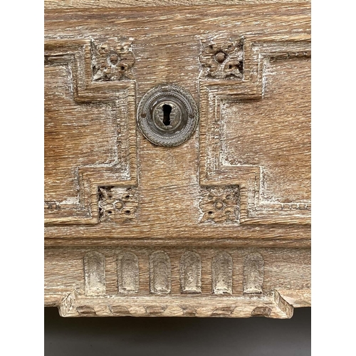 153 - COMMODE, early 19th century French bleached carved oak and silvered metal mounted with three long dr... 