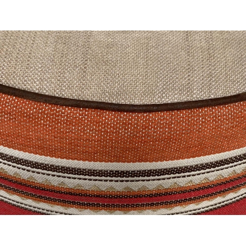 158 - STOOL, circular piped linen and Moorish style woven border, 63cm W x 32cm H .