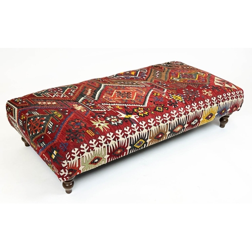 221 - KILIM FOOTSTOOL, Anatolian kilim upholstered with turned supports, 35cm H x 137cm x 69cm.