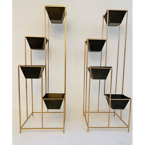 537 - TIERED PLANTERS, pair, 145cm high x 49cm wide, black troughs in gilt metal frame. (2)