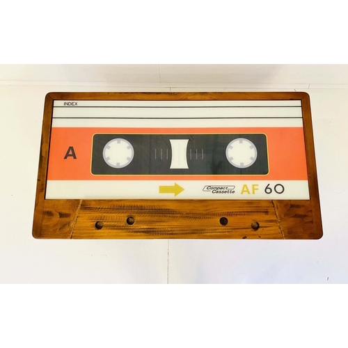 545 - LOW TABLE, 40cm high x 110cm wide x 60cm deep, cassette tape design, with storage to one side.