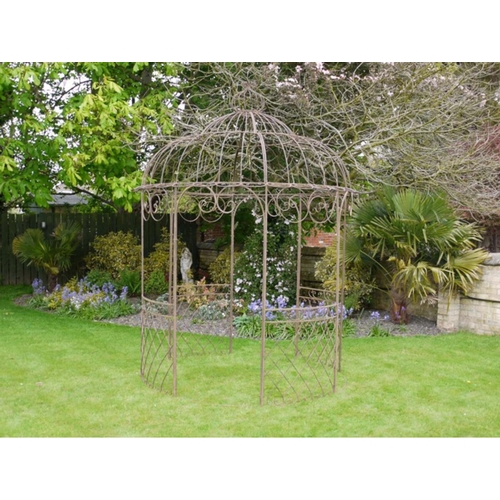 564 - ARCHITECTURAL GARDEN PERGOLA, 300cm H x 225cm diam, Regency design, oxidised metal.