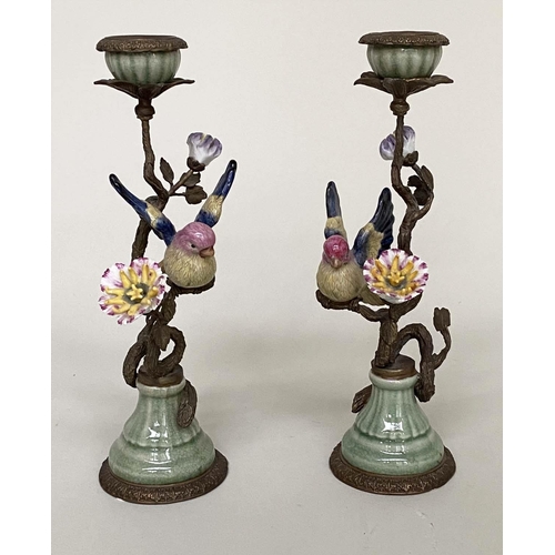 365 - CANDLESTICKS, a pair, Continental style painted porcelain and gilt metal mounted modelled as finches... 