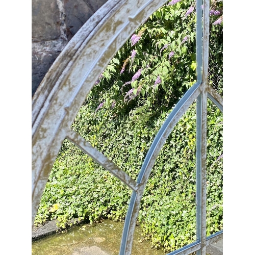 505 - ARCHITECTURAL GARDEN MIRRORS, a set of three, 160cm high x 67cm wide, Gothic style, aged metal frame... 