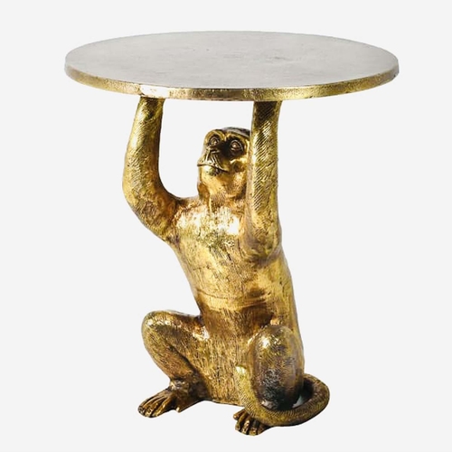 507 - SIDE TABLE, 50cm high x 44cm diameter, in the form of a monkey holding a serving tray aloft, gilt fi... 