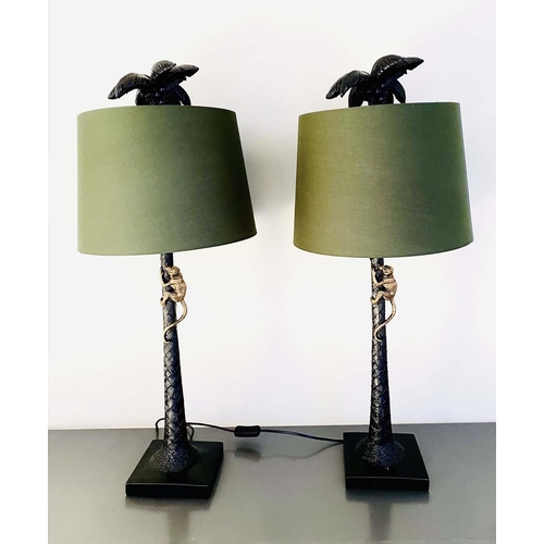 518 - TABLE LAMPS, a pair, 84cm high x 36cm diameter, green shades, palm tree bases with a climbing monkey... 