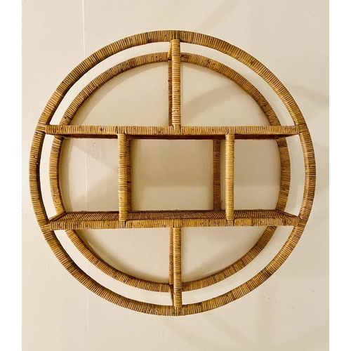 523 - WALL MOUNTED ETAGERE, 80cm diameter x 18cm deep, 1970s Italian style rattan.