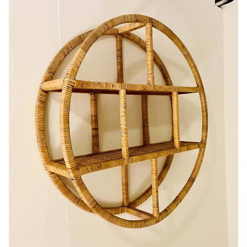 523 - WALL MOUNTED ETAGERE, 80cm diameter x 18cm deep, 1970s Italian style rattan.