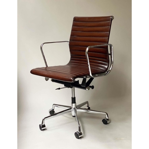 109 - REVOLVING DESK CHAIR, Charles and Ray Eames inspired with ribbed tan leather seat revolving and recl... 