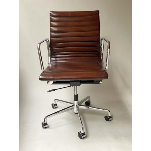 109 - REVOLVING DESK CHAIR, Charles and Ray Eames inspired with ribbed tan leather seat revolving and recl... 