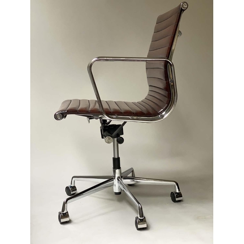 109 - REVOLVING DESK CHAIR, Charles and Ray Eames inspired with ribbed tan leather seat revolving and recl... 