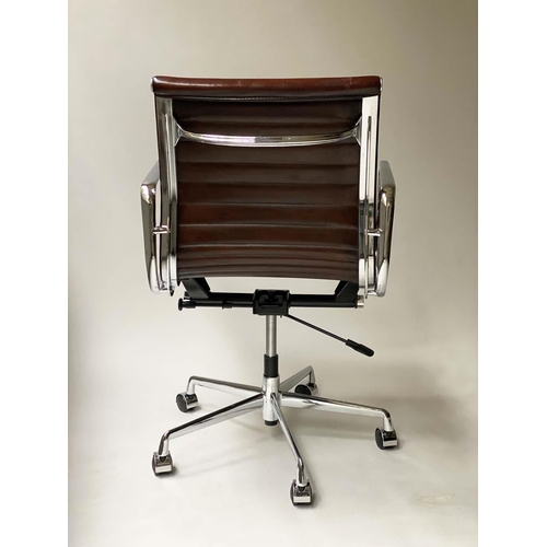 109 - REVOLVING DESK CHAIR, Charles and Ray Eames inspired with ribbed tan leather seat revolving and recl... 