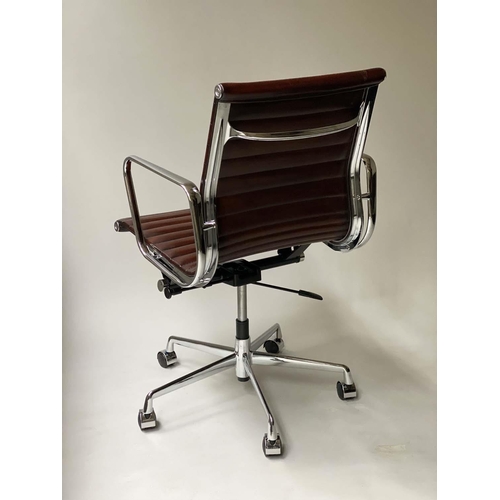 109 - REVOLVING DESK CHAIR, Charles and Ray Eames inspired with ribbed tan leather seat revolving and recl... 