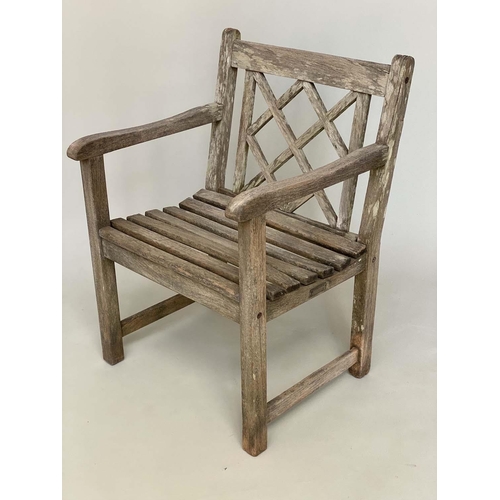 128 - GARDEN ARMCHAIRS BY ALEXANDER ROSE, a pair, weathered teak each slatted construction with lattice ba... 