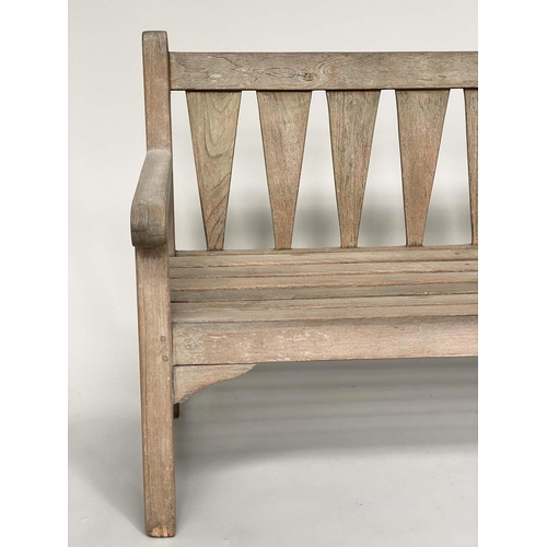 129 - GARDEN BENCH, weathered teak of slatted construction with triangular splat back, 140cm W.