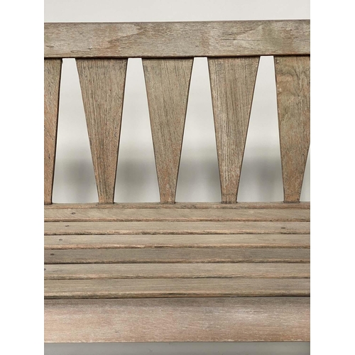 129 - GARDEN BENCH, weathered teak of slatted construction with triangular splat back, 140cm W.