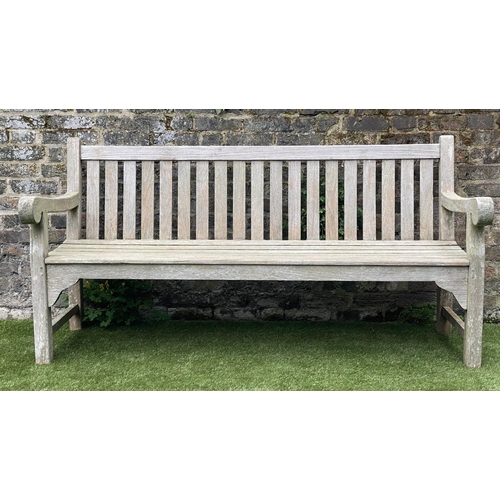 131 - GARDEN BENCH, weathered teak of large size and substantial slatted construction, 180cm W.