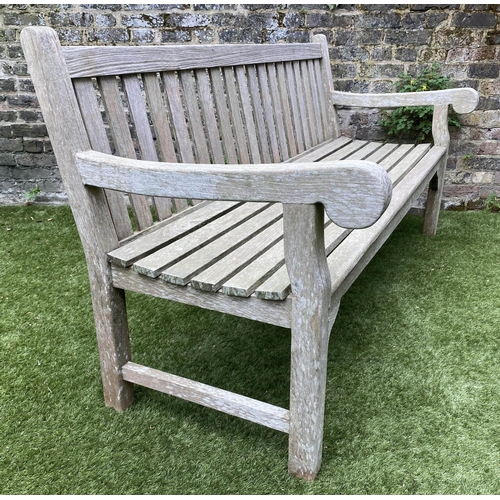 131 - GARDEN BENCH, weathered teak of large size and substantial slatted construction, 180cm W.