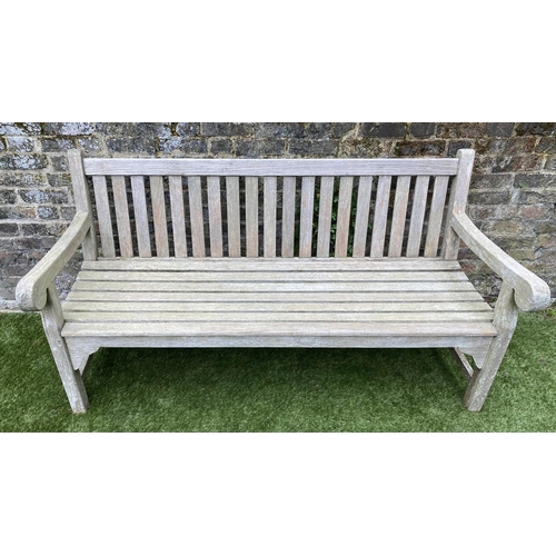 131 - GARDEN BENCH, weathered teak of large size and substantial slatted construction, 180cm W.